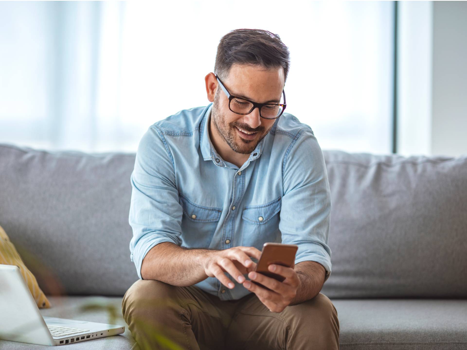 man looking at smartphone